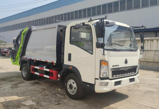 O ³ de Commercial Vehicles 8m do comerciante do caminhão que carrega o modo HOWO da movimentação 4×2 comprimiu o caminhão de lixo 7,5 medidores por muito tempo
