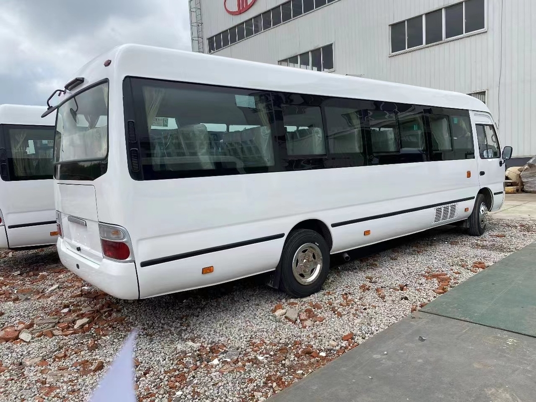 Autocarro usado de montanha-russa Mudan Minibus 30 lugares Direito Direito Direito Uso na Tanzânia Primavera de folhas para estrada ruim