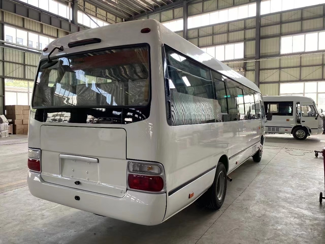 Autocarro usado de montanha-russa Mudan Minibus 30 lugares Direito Direito Direito Uso na Tanzânia Primavera de folhas para estrada ruim