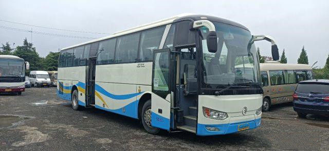 O ônibus de excursão usado para África usou o baixo quilômetro do chassi dourado da bolsa a ar do Euro IV de Dragon Bus Yuchai Rear Engine 233kw 53seats